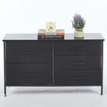 5-drawer storage cabinet TV stand with black finish, wooden top, and decorative items.