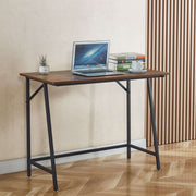 Compact computer desk for students with a laptop on top, ideal for small spaces and home office use.