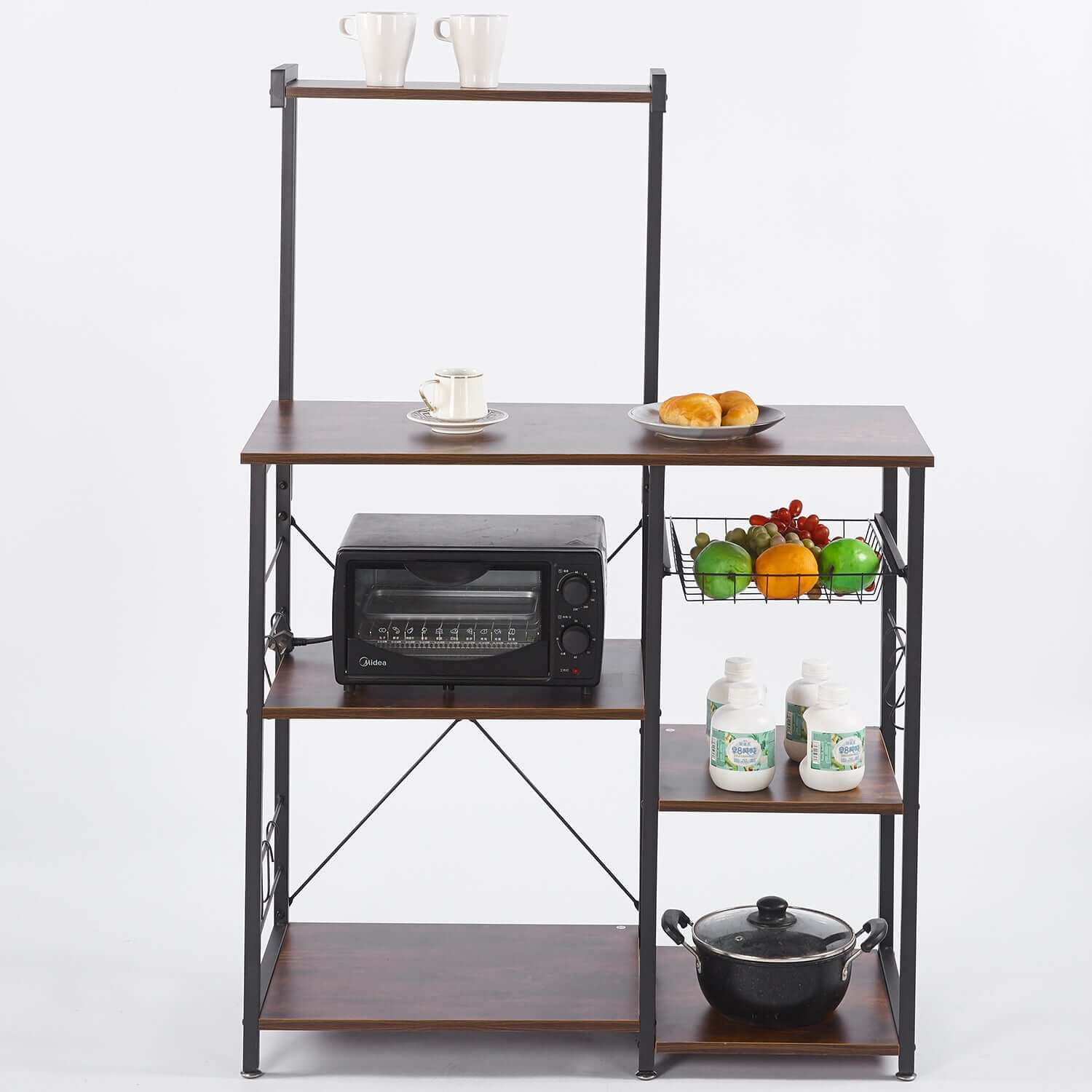 Kitchen Baker's Rack with Microwave Stand and Wire Basket, featuring coffee cups, fruits, and kitchen storage.