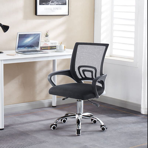 Artisan black mesh office chair side view at lowest height with curved armrests.