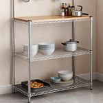 Heavy-Duty Baker's Rack with wooden top and organized kitchenware including bowls and pots.