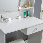 White Dressing Table with LED Mirror showcasing a modern design, elegant lighting, and beauty products arranged neatly.