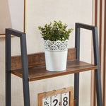 Open display shelves on ladder bookshelf with drawer