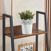 Open display shelves on ladder bookshelf with drawer