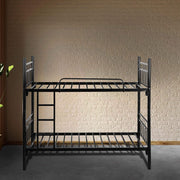 Black metal bunk bed against a textured beige wall.