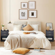 Modern bedroom with matching black bedside tables on both sides of the bed