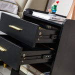Close-up of black bedside table drawers and metal drawer runners