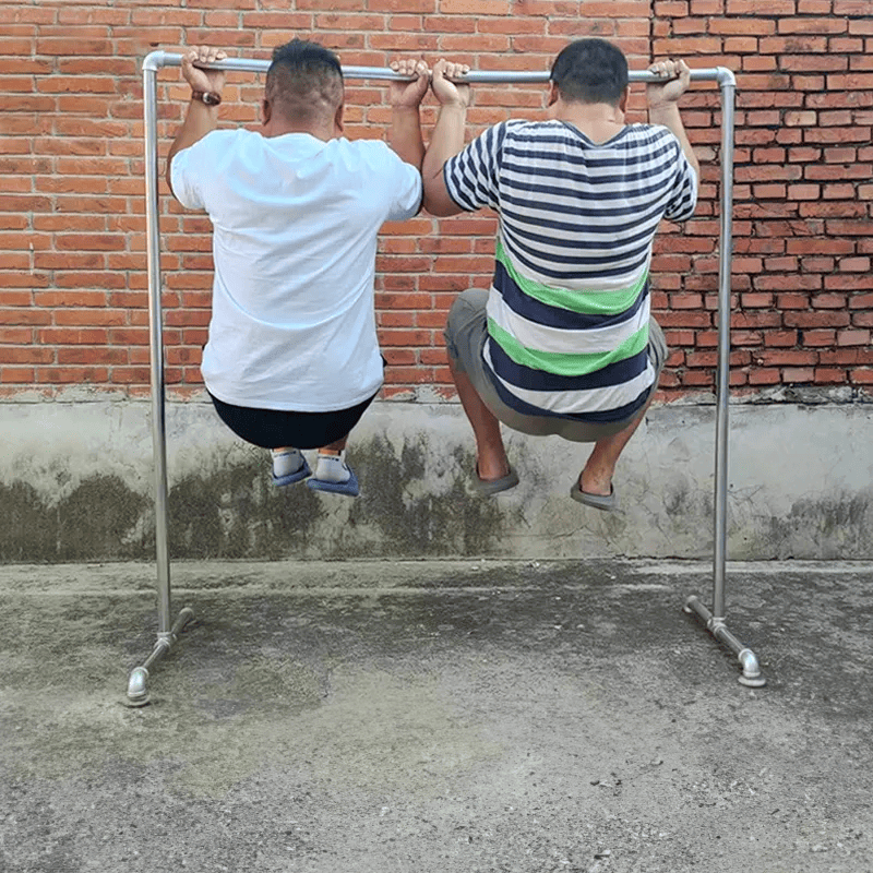 Double clothes rack CDR-02 - two individuals using a metal pull-up bar against a brick wall | Artisansa SA