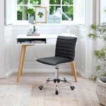 Adjustable bar stool set in a modern workspace with a stylish desk and natural light.