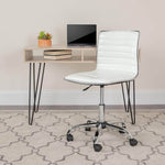 Adjustable bar stool set in a modern workspace with a white seat and sleek desk setup.