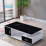 Coffee table with black marble top and white base in a living room setting | Artisansa SA