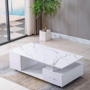 White marble coffee table in a modern living room with a plant and large mirror. | Artisansa SA