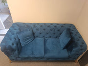 Velvet Chesterfield Sofa in elegant blue color with deep button tufting, perfect for stylish home decor.