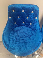 Velvet Blue Bar Chairs featuring a plush seat with diamond tufting and decorative buttons, perfect for elegant home décor.