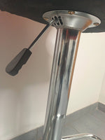 Close-up of the adjustable height mechanism of Retro Style Bar Chairs, showcasing sturdy chrome and black material.