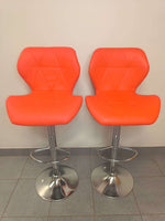 Retro Style Bar Chairs set of 2 in vibrant orange leather with chrome bases, ideal for modern kitchens or entertainment areas.