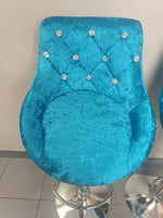 Velvet Bar Chairs featuring a luxurious blue fabric with jewel accents, perfect for modern kitchen or entertainment spaces.