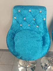 Velvet Bar Chairs featuring a luxurious blue fabric with jewel accents, perfect for modern kitchen or entertainment spaces.