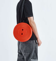 Person holding red circular bag - retractable telescopic foot stool KJ-01 carry case | Artisansa SA