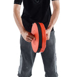 Person holding red and black disc - retractable telescopic foot stool KJ-01 folded | Artisansa SA