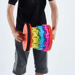 Person holding colourful resistance band - retractable telescopic foot stool KJ-01 accessory | Artisansa SA