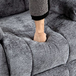 Hand pressing down on plush fabric of Electric Power Lift Recliner, showcasing comfort and quality.