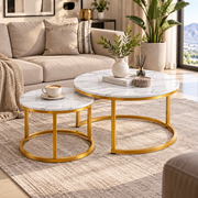 Close-up of white marble-look tabletop and gold metal frame details