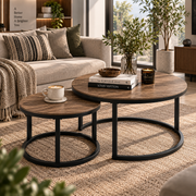 Wood-effect nesting coffee tables with black frames in a warm natural living room