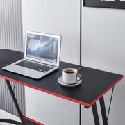 L-Shaped Desk with Monitor Shelf featuring a laptop and coffee cup on a modern black and red surface.