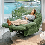 A woman relaxing on a swivel rocker glider couch with phone holder, showcasing comfort and modern design.