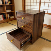 Modern 3-Drawer Nightstand with gold handles and one drawer open, showcasing a minimalist design and warm wood finish.