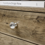 Close-up of a drawer knob from a White Bedside Table with Drawers, showcasing its elegant crystal design.