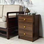 Modern 3-Drawer Nightstand with Gold Handles next to a traditional sofa, showcasing elegant design and practical storage.