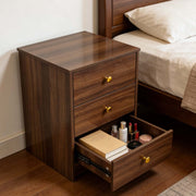 Modern 3-Drawer Nightstand with Gold Handles, showcasing open drawer filled with cosmetics and books.