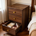 Modern 3-Drawer Nightstand with gold handles showcasing open drawer and stylish decor items.