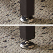 Close-up of adjustable legs on a TV stand with charging station, showcasing sturdy metal and stability features.