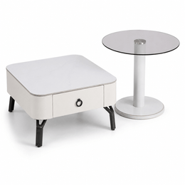 White side table with a drawer and a round glass top table on a white background