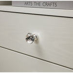 Close-up of a crystal knob on a White Bedside Table with Drawers, showcasing elegant design details.