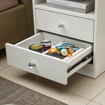 White Bedside Table with Drawers showcasing an open drawer filled with magazines and decorative items.