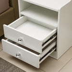 White Bedside Table with Drawers featuring two open drawers and a sleek design in a modern bedroom setting