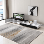Fully extended black and white TV stand with open cabinet and two storage drawers in a lounge