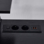 Close-up of black built-in AC power outlets and USB ports