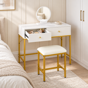 White and gold dressing table with one drawer open in a bedroom