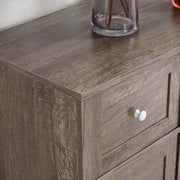 Close-up view of the Farmhouse Sideboard Storage cabinet with a rustic brown finish and drawer detail.