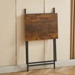 Rustic folding TV tray table standing against a wall, designed for easy storage and portability.