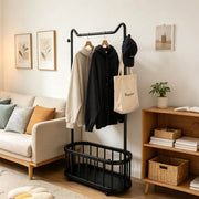 Freestanding Clothes Rack with hoodies and a bag in a stylish living room setting.