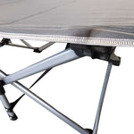 Close-up of reinforced X-frame structure on heavy-duty folding camping cot