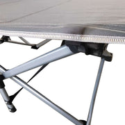 Close-up of reinforced X-frame structure on heavy-duty folding camping cot