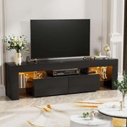 Angled black TV unit with two drawers and warm LED-lit side shelves