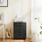 Black Bedside Table with Drawers (5-Tier) serving as a mobile pedestal beside a desk and printer.